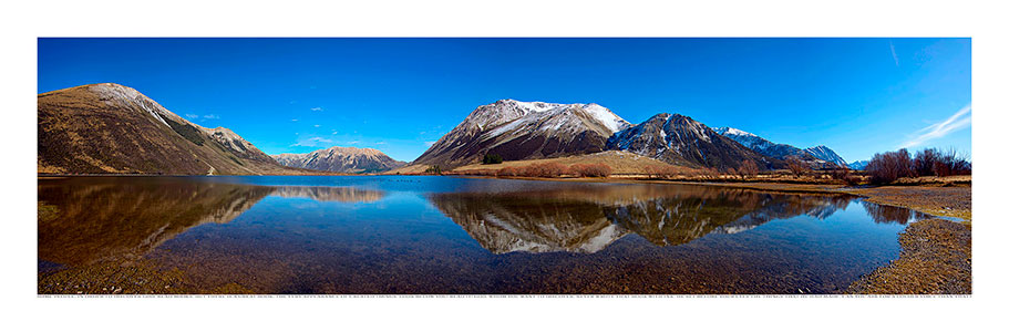 Wide panoramic NZ Pearson lake with reflection of mountains.